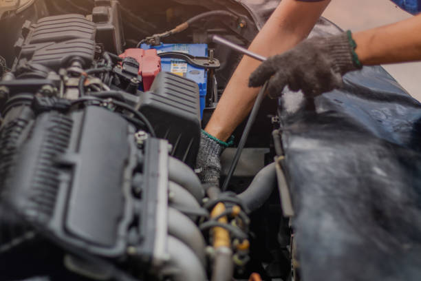 istock Hand of car mechanic check the car engine 1159216911