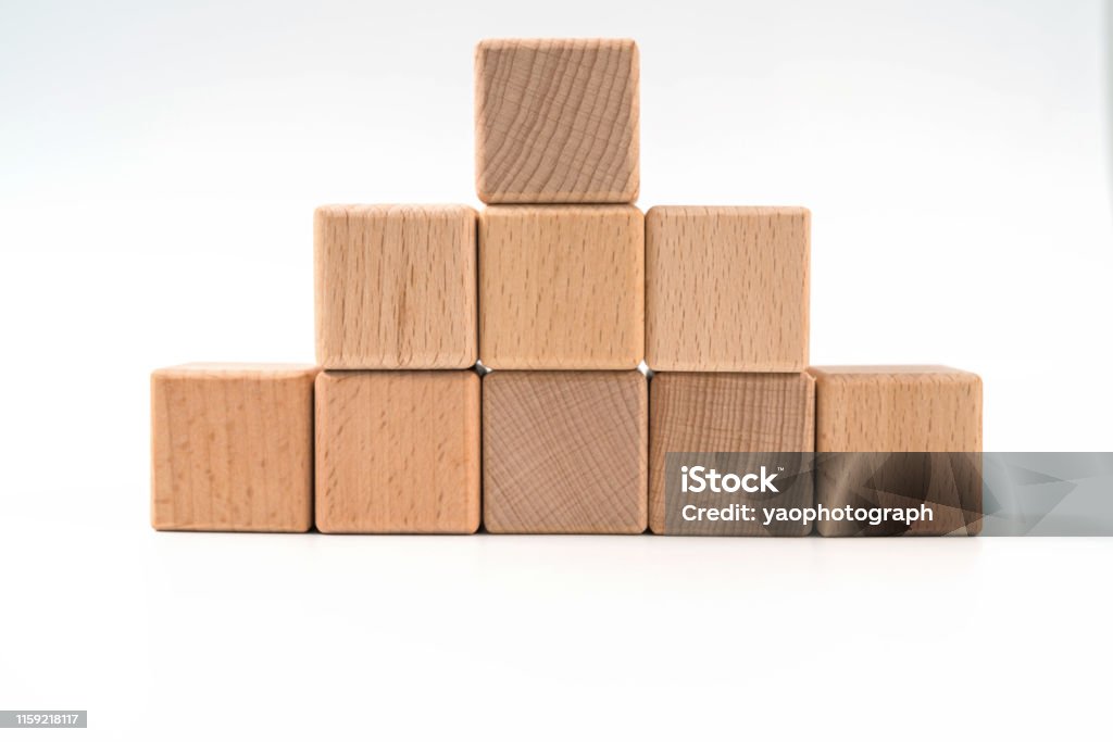 wood cube arrange in pyramid shape ,business concept Abstract Stock Photo