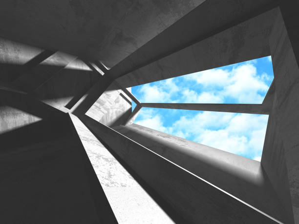istock Concrete room wall construction on cloudy sky background 1159218525