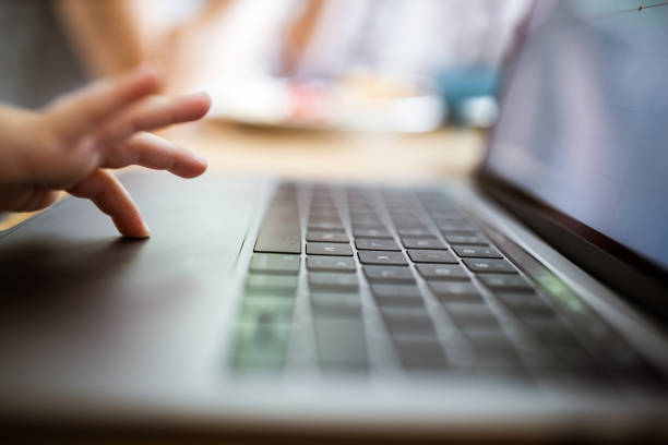 istock Close up of unrecognizable child using laptop. 1159219482