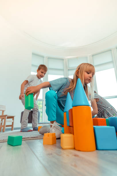 istock Low angle of a toy castle being build 1159219799