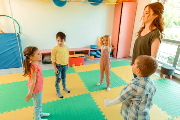 istock Nice pleasant children standing in the circle 1159219821