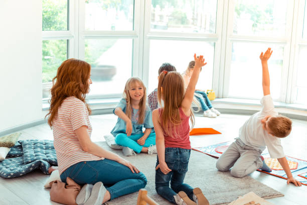 istock Happy nice children sitting in the circle 1159219878
