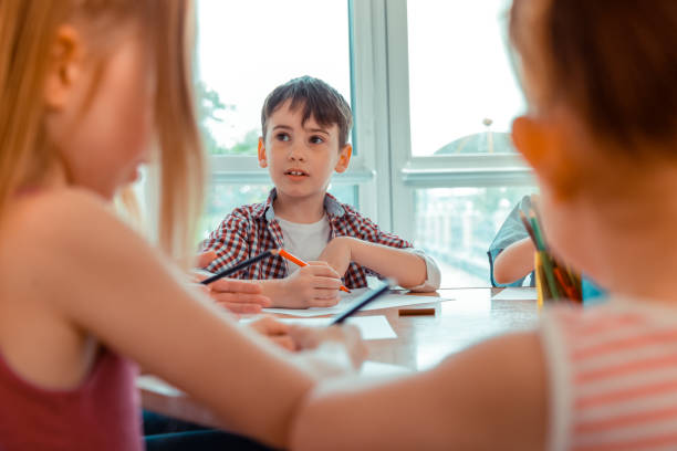 istock Nice pretty boy holding a pencil in his hand 1159220023