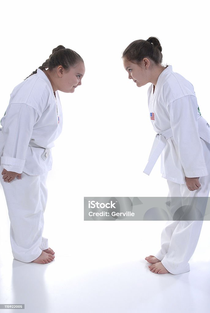 Respect Beginning martial artist bowing to each other. Bowing Stock Photo