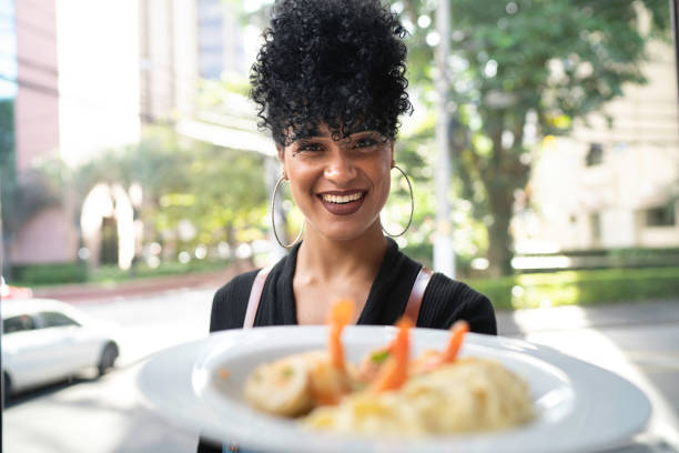 istock Portrait of chef showing a plate 1159220840