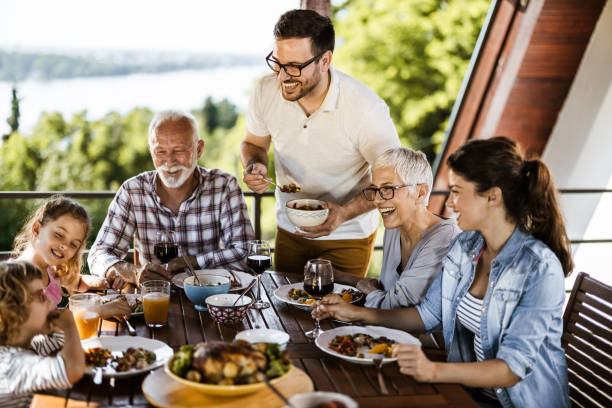 istock Happy multi-generation family talking while having a meal on a terrace. 1159221268