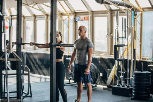 istock Woman training with fitness instructor 1159225583