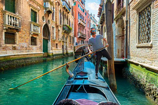 Gondolier with a paddle