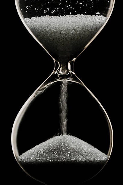 istock Close-up of hourglass with black sand 115922828