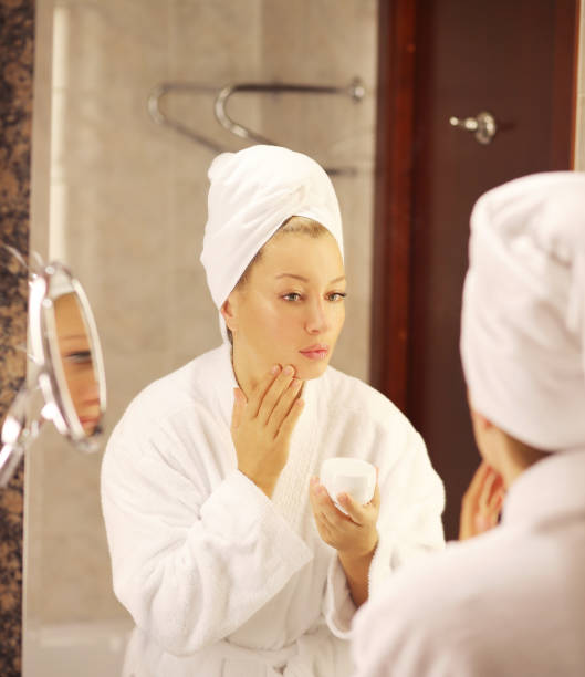 istock Magic anti-aging cream.Applying the cream 1159229871