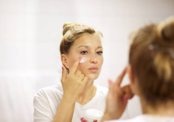 istock Magic anti-aging cream.Applying the cream 1159229876