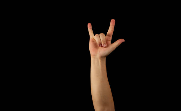 istock The hand of a young man on a black background 1159231895