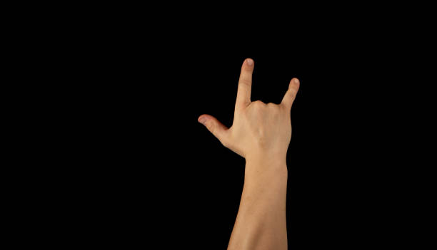 istock The hand of a young man on a black background 1159231896