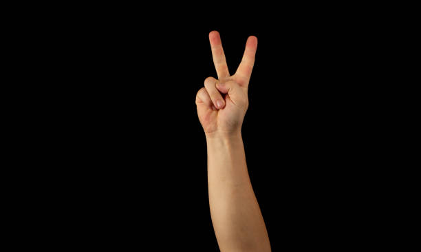 istock The hand of a young man on a black background 1159231897