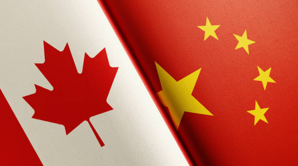 istock Canadian And Chinese Flag Pair 1159234396