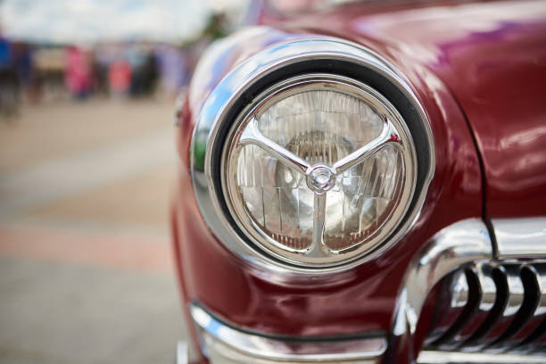 istock Unusual front headlight, old burgundy car 1159236401