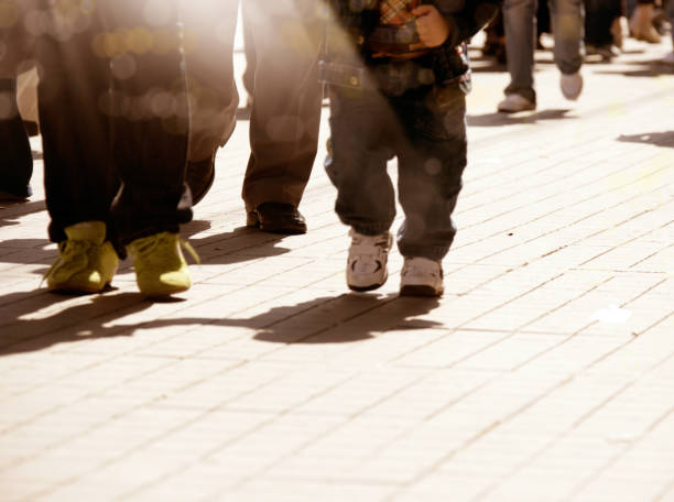 istock close up crowded people walking on busy street 1159236462