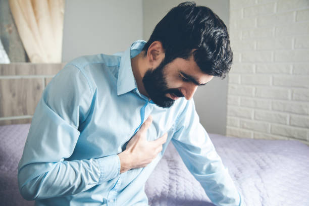 istock man ache heart in room 1159236659