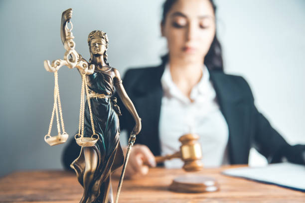 istock woman hand  judge with document and justice lady 1159236681