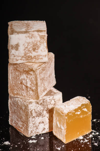 istock Turkish delight, sweets on a black background (dessert sweets) lokum. food background. top view. copy space 1159238880