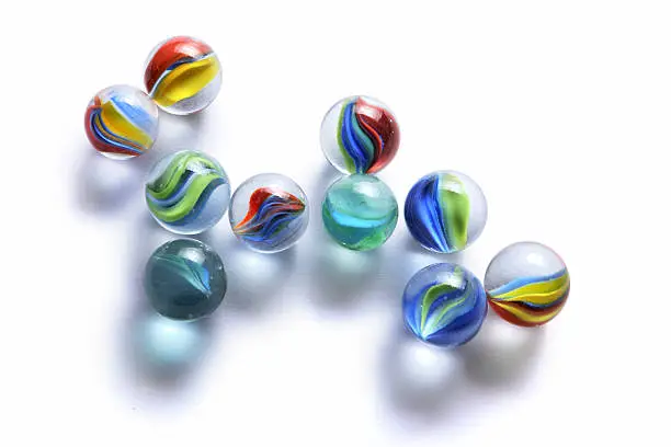 Photo of Toys: Marbles Isolated on White Background