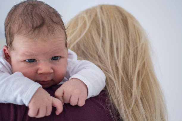 istock Newborn baby boy with his mother 1159240098