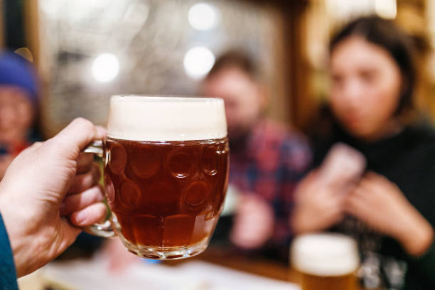 istock Friends drinking authentic craft beer in czech pub and clinking 1159240403