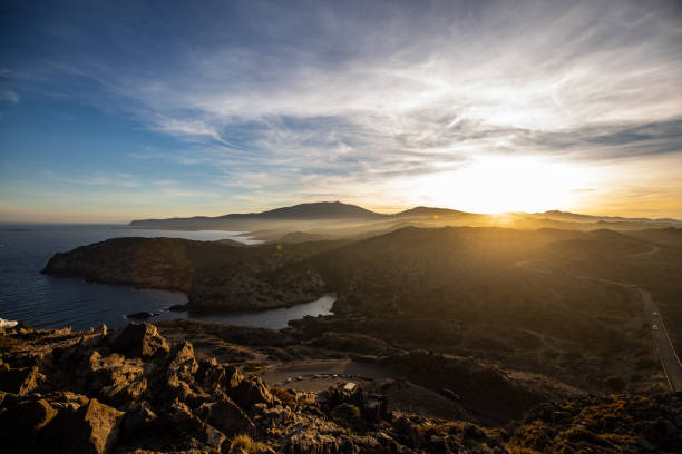 istock Sunset over sea cliffs and low clouds with clear sky view from Cap de Creus, Catalonia (SPAIN) 1159242430
