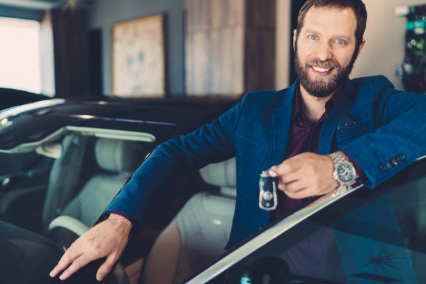 istock Businessman buying new car 1159242862