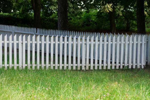istock long white decorative wooden plank fence 1159243703