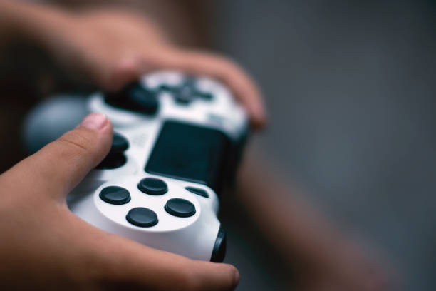 Joystick in game. Close-up of hands holding gamepad. Games concept. Joystick in game. Close-up of hands holding gamepad. Games concept. game controller photos stock pictures, royalty-free photos & images