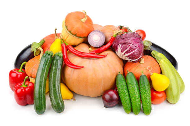 Heap different fruits, vegetables and berries isolated on white background