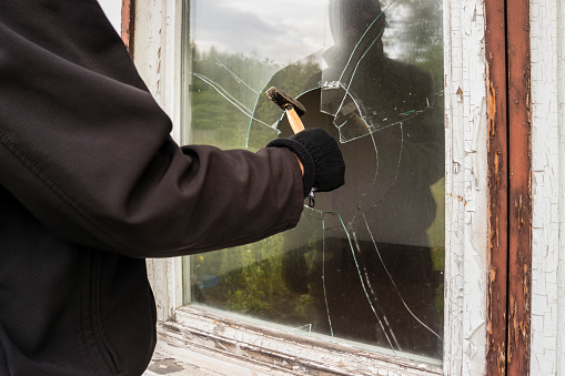 Burglar entering to house trough window