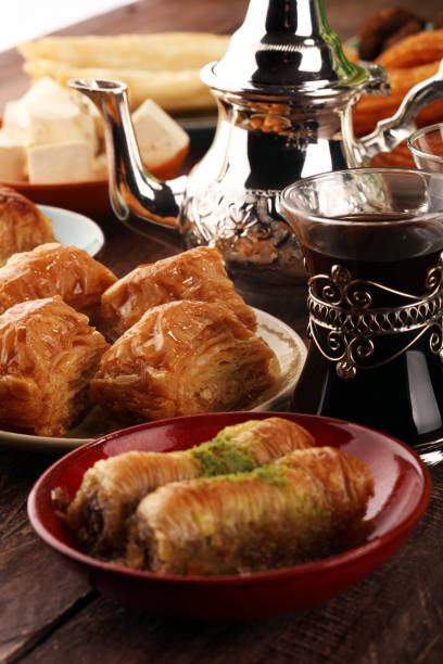 istock Middle eastern or arabic dishes and assorted meze, concrete rustic background. Turkish Bread or Turkish pizza. Dessert Baklava with pistachio. falafel with hommos.  Halal food. Lebanese cuisine 1159249269