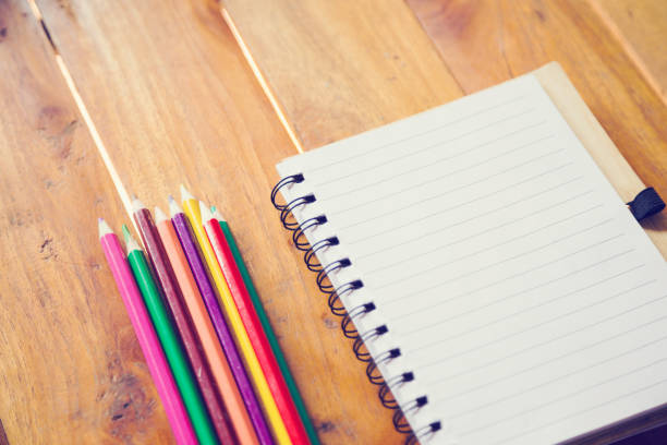 istock Student's desk with blank holiday phone 1159251179