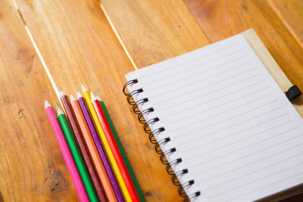 istock Student's desk with blank holiday phone 1159251205
