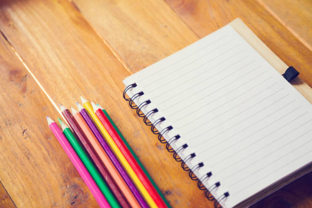 istock Student's desk with blank holiday phone 1159251254