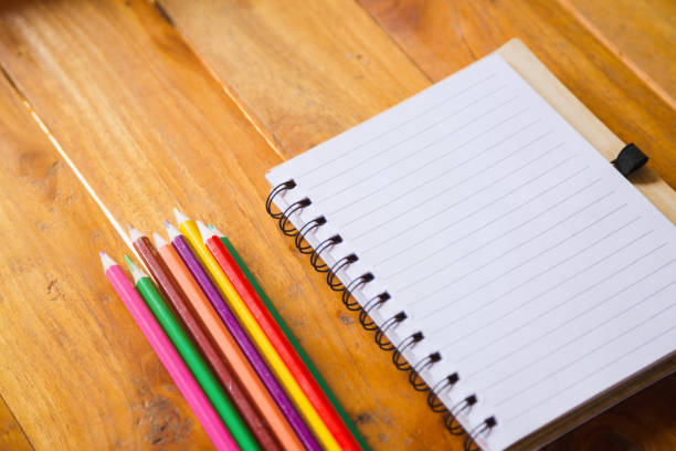 istock Student's desk with blank holiday phone 1159251263