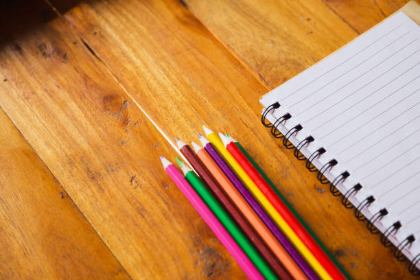 istock Student's desk with blank holiday phone 1159251313