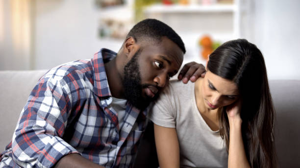 istock Black husband calming and supporting sad wife, health problems, miscarriage 1159252148