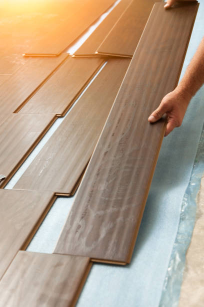 istock Man Installing New Laminate Wood Flooring 1159259663