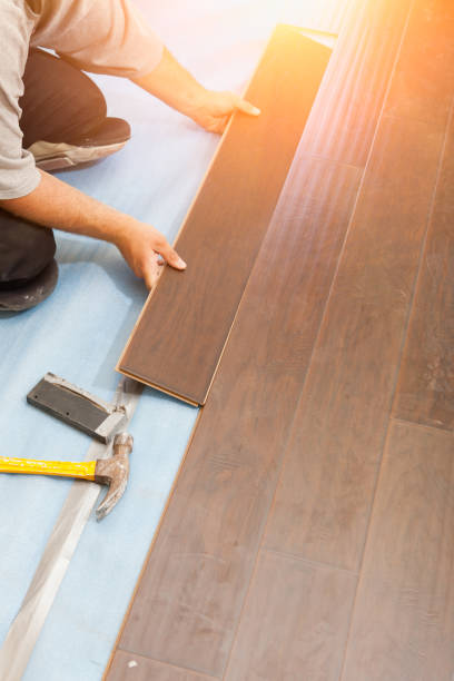 istock Man Installing New Laminate Wood Flooring 1159259667
