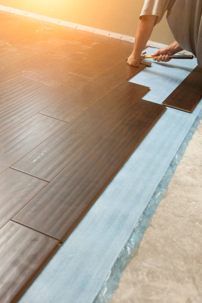 istock Man Installing New Laminate Wood Flooring 1159259670