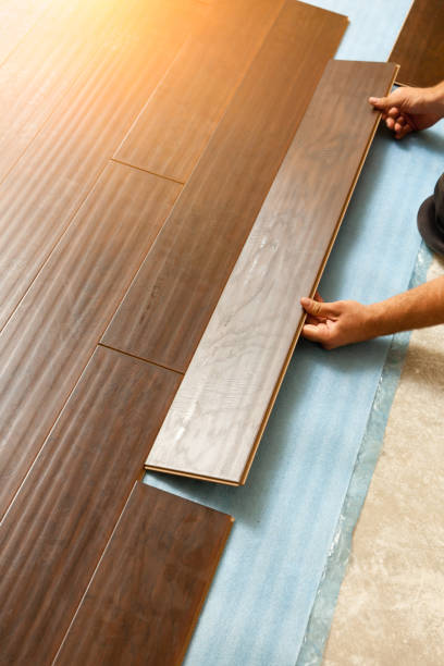 istock Man Installing New Laminate Wood Flooring 1159259672