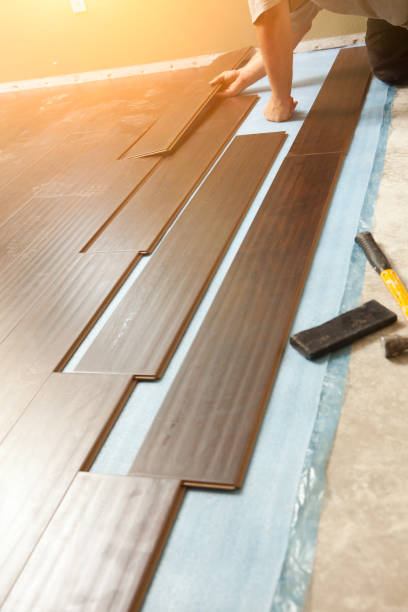 istock Man Installing New Laminate Wood Flooring 1159259684