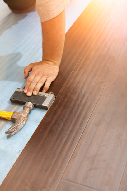 istock Man Installing New Laminate Wood Flooring 1159259685
