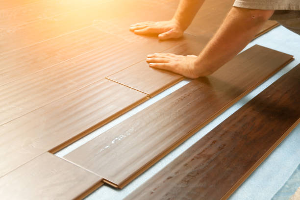 istock Man Installing New Laminate Wood Flooring 1159259692