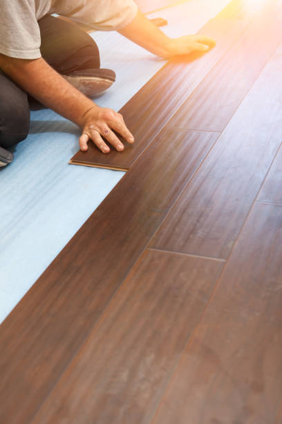 istock Man Installing New Laminate Wood Flooring 1159259695