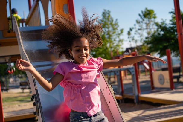istock Playful girl at a playground 1159259773